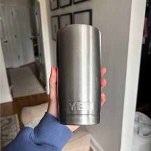 Yeti tumbler cup silver 20 oz tumbler sticker on it